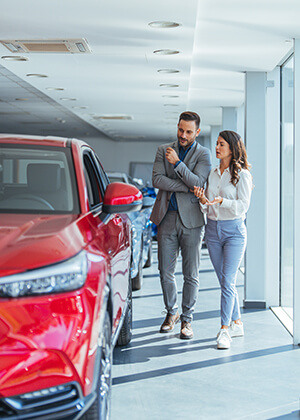 Couple looking at new cars in a Central Indiana dealership